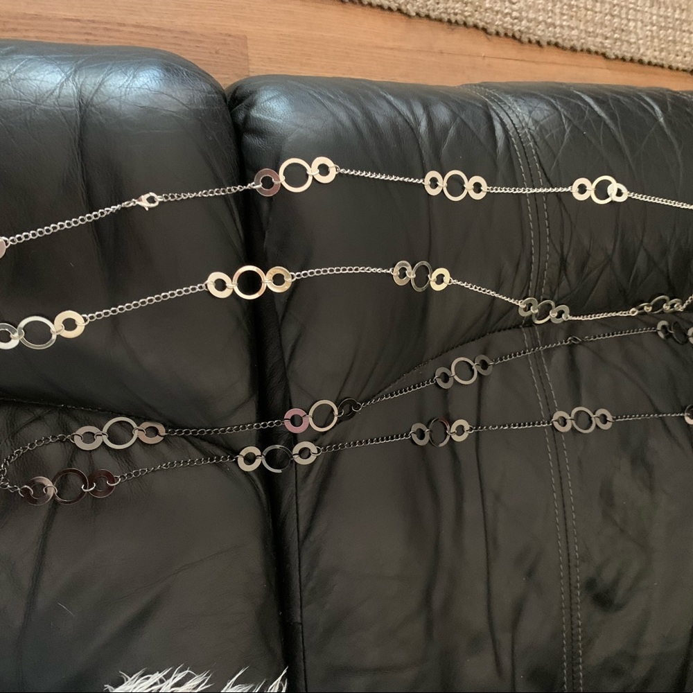 (2) necklaces one shiny silver other shiny black